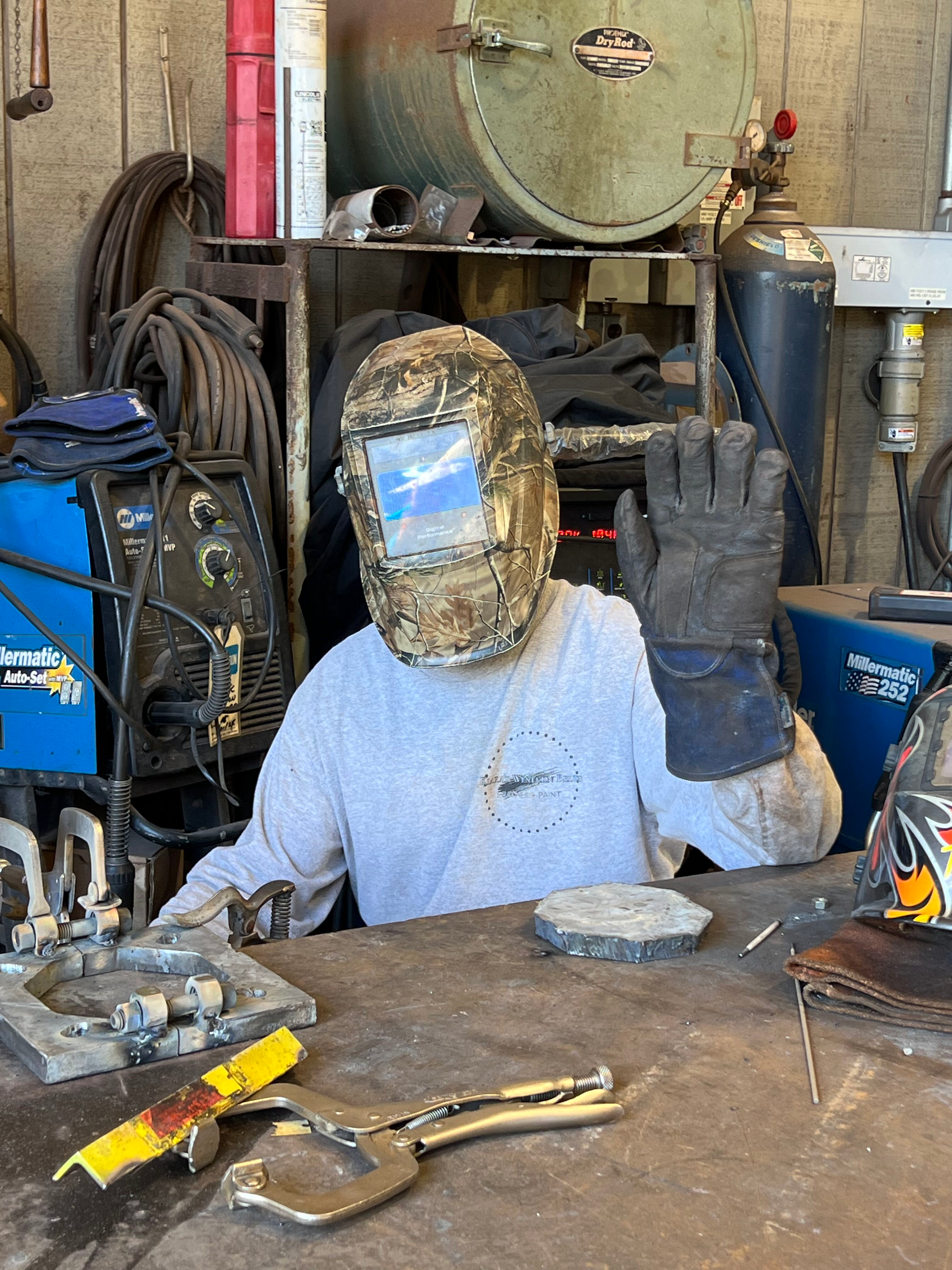 Weylon Ruiz, power plant maintenance person, wears safety gear while working