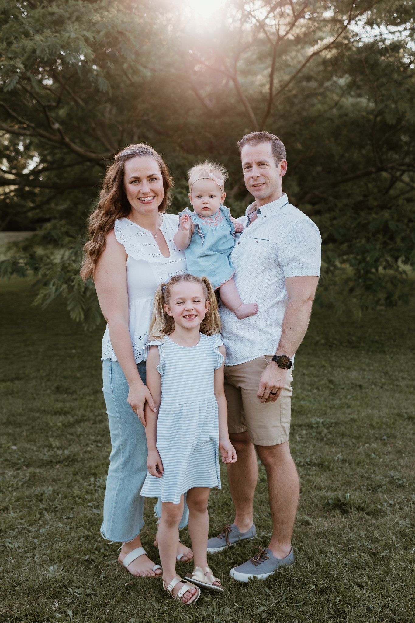 Family of four smiling