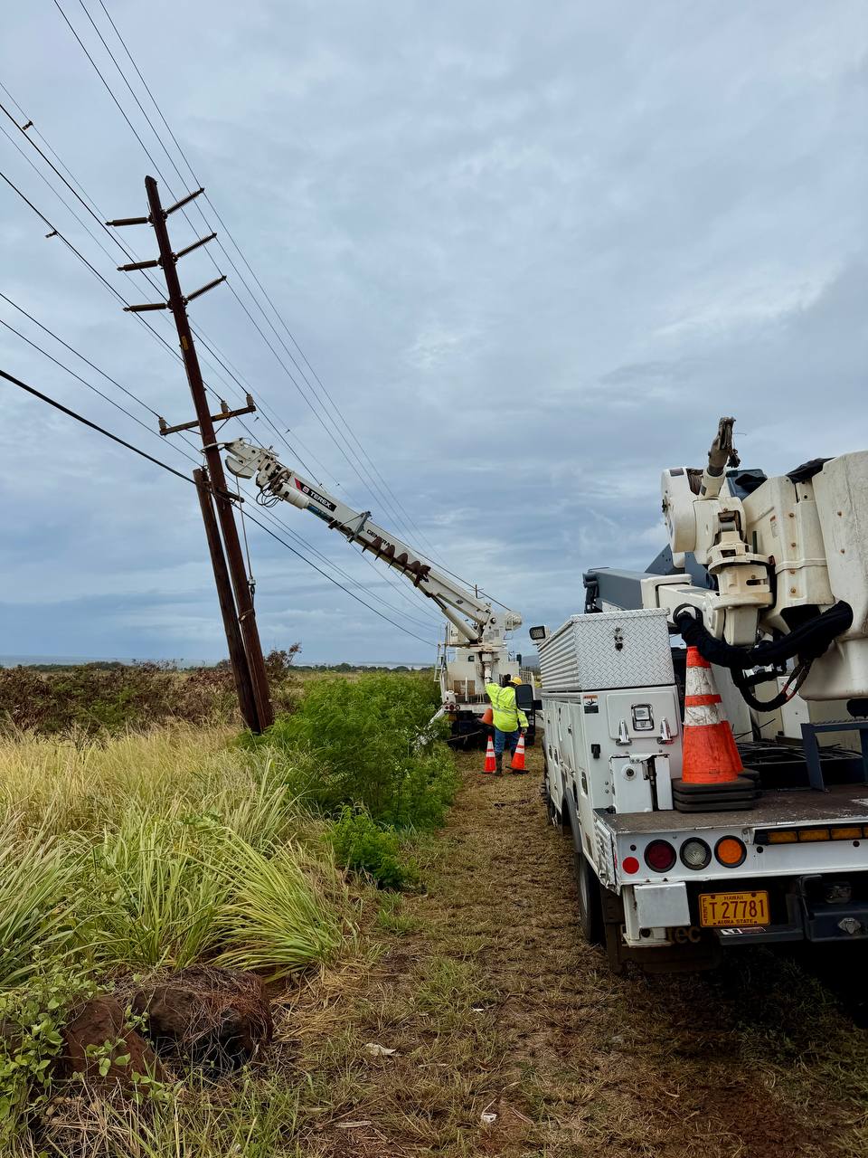 electric utility crews repair lines after storm damage