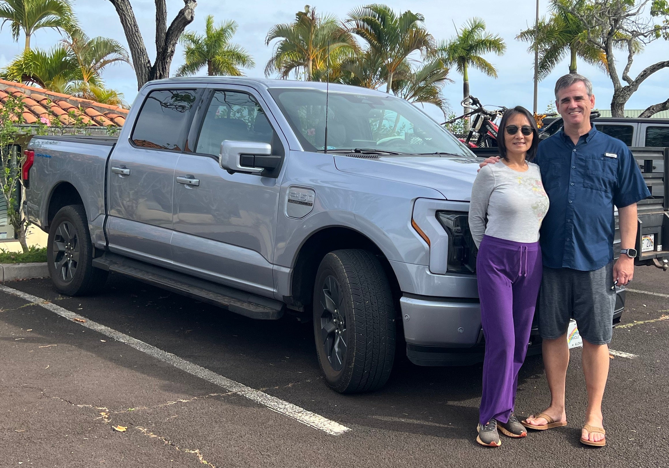 Cynthia and Chris Luff standing next to their Ford Lightning truck