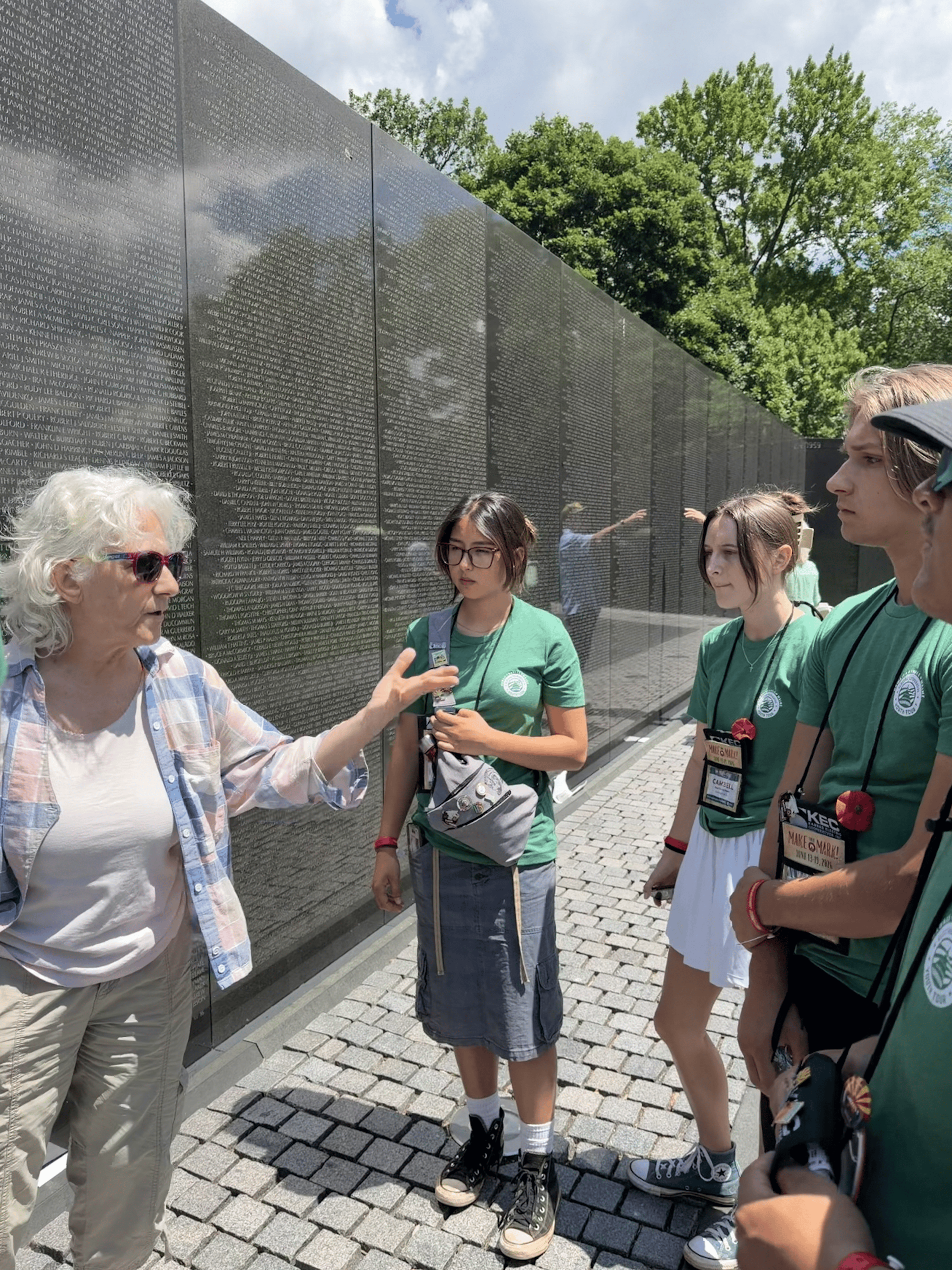 tour guide in front of Vietnam War memorial